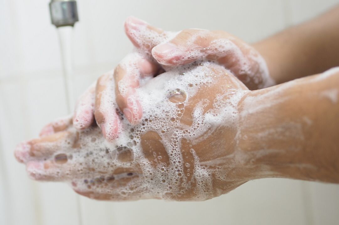 washing hands with soap to prevent parasite contamination