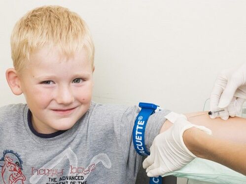 A child gives blood for analysis if it is suspected that he is infected with parasites.